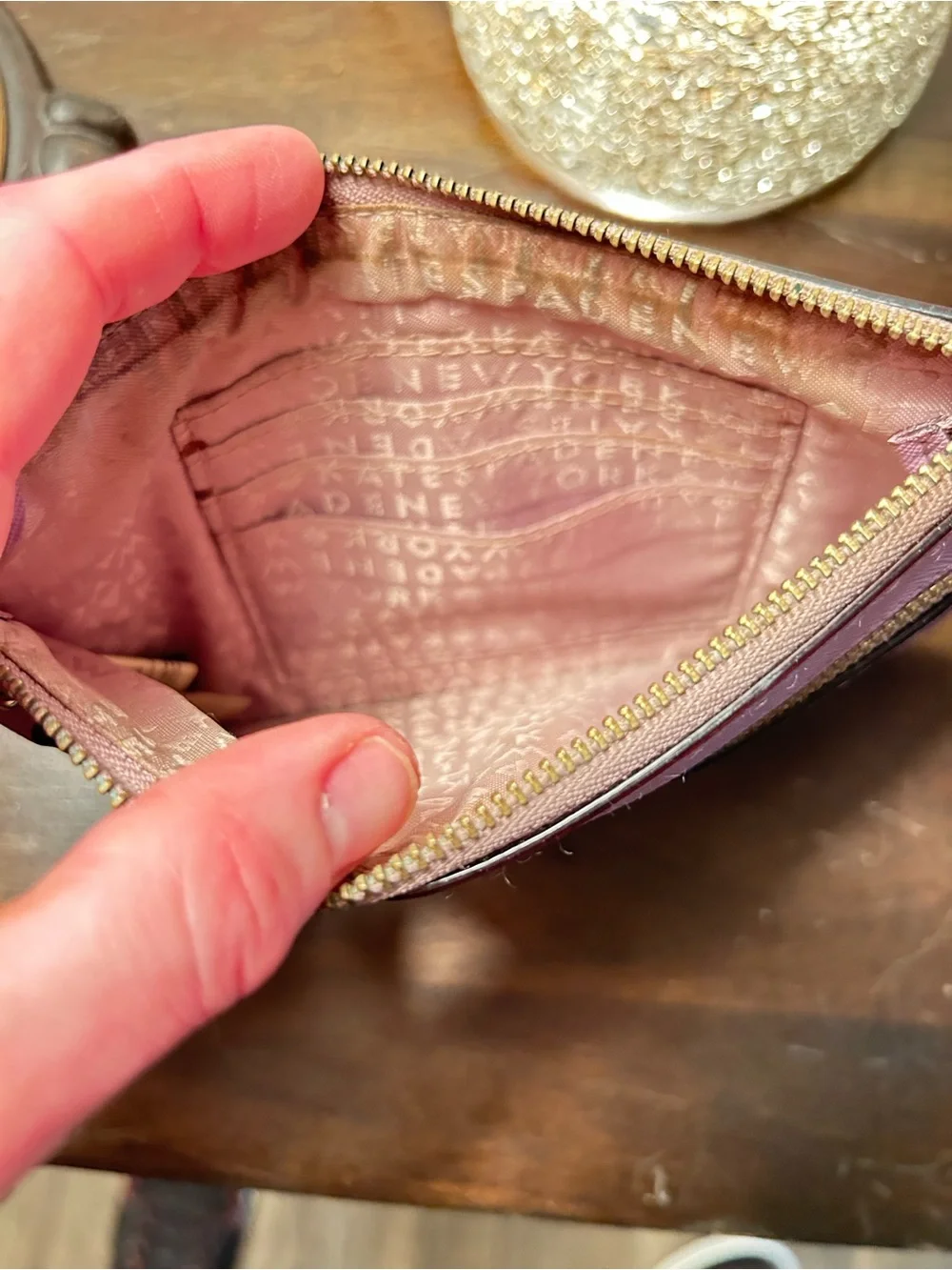 kate spade mauve wristlet with front zip pocket